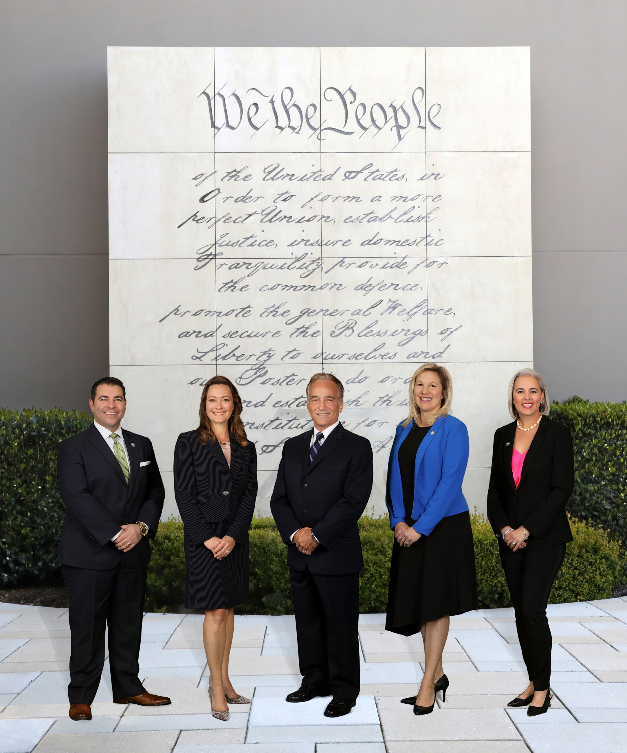 Group portrait of Laguna Niguel City Council standing before a Constitution backdrop.