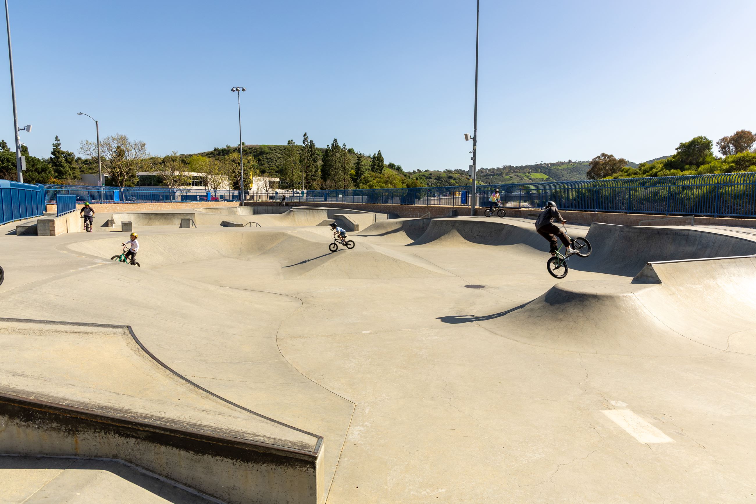 Cyclists riding through bowls at Laguna Niguel Skatepark